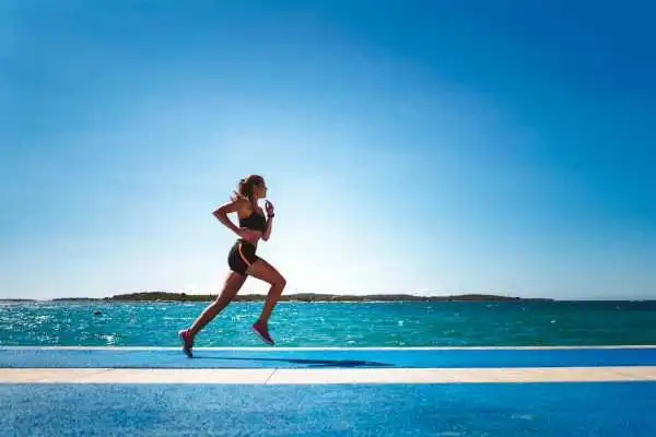 Woman running showing strong leg muscle Kingston-upon-Hull